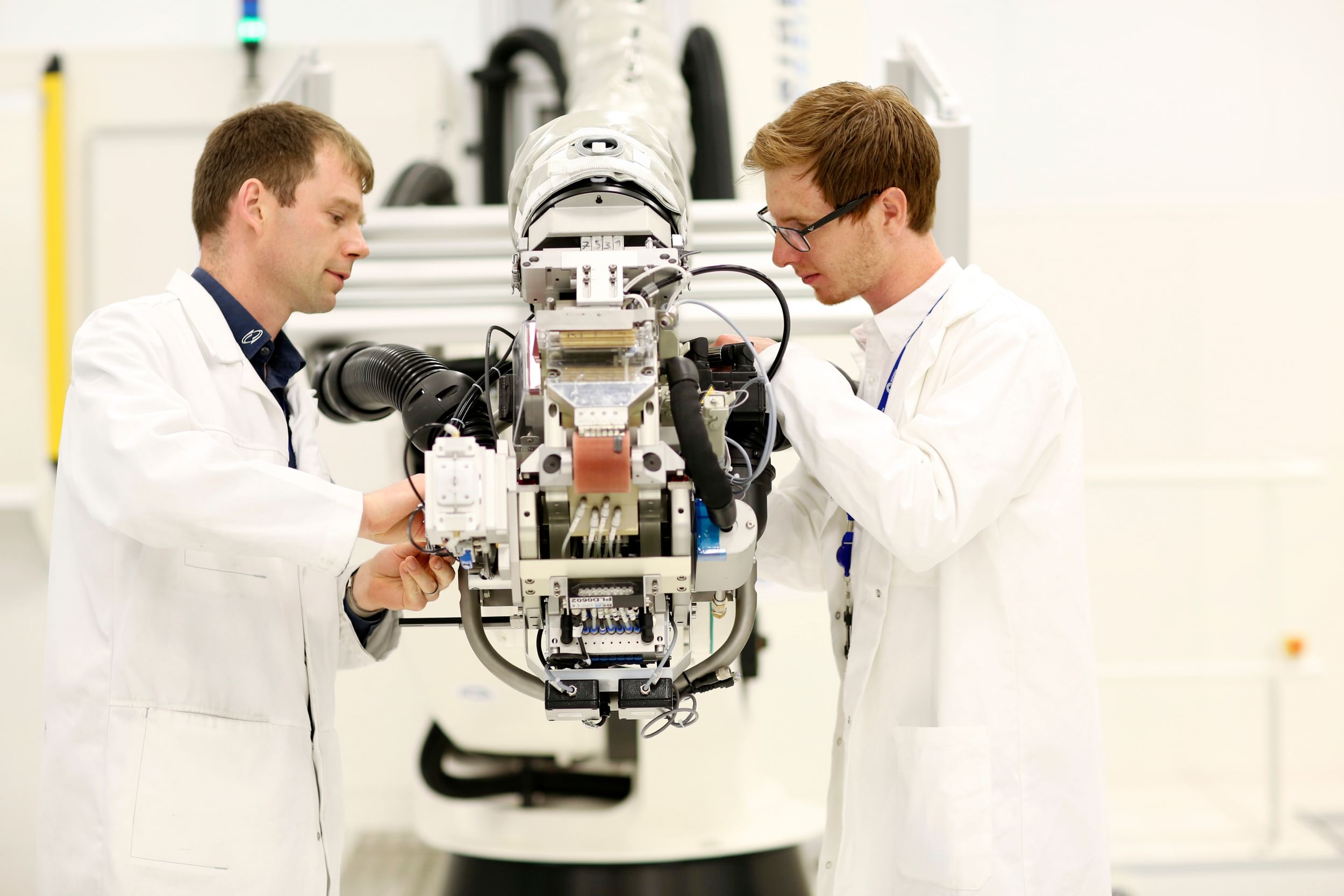 Two men working on robotics at the National Composites Centre