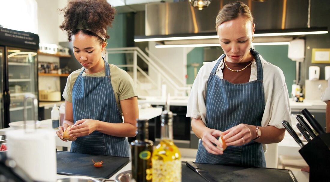 2 chefs preparing food