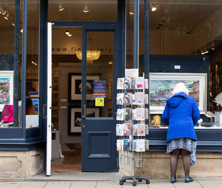 Woman looking in a shop window