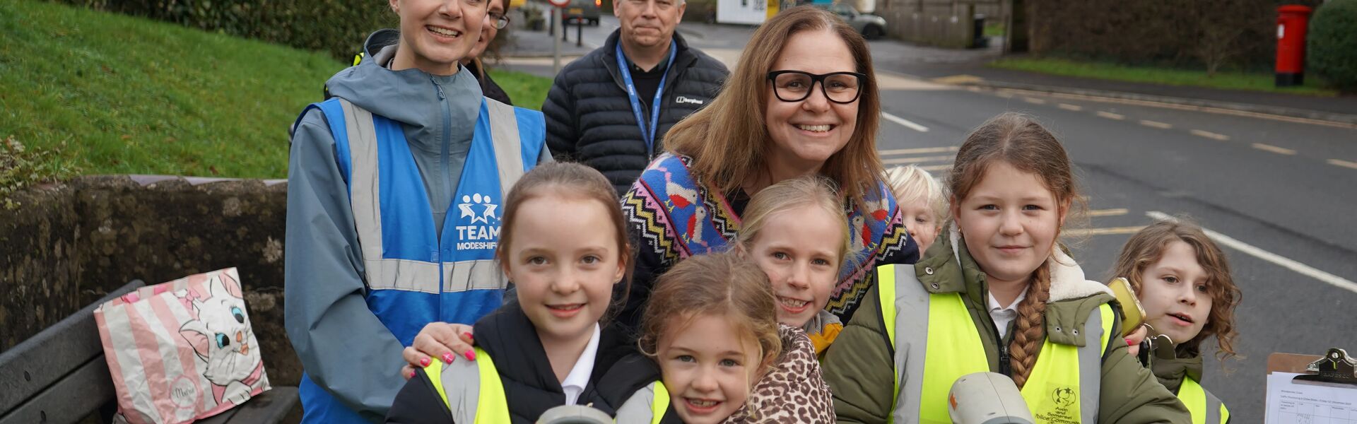 Mayor with kids by a road