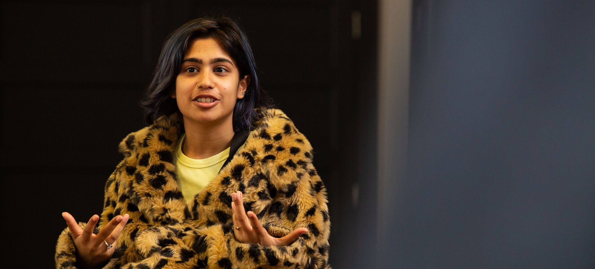 Young person speaking at event