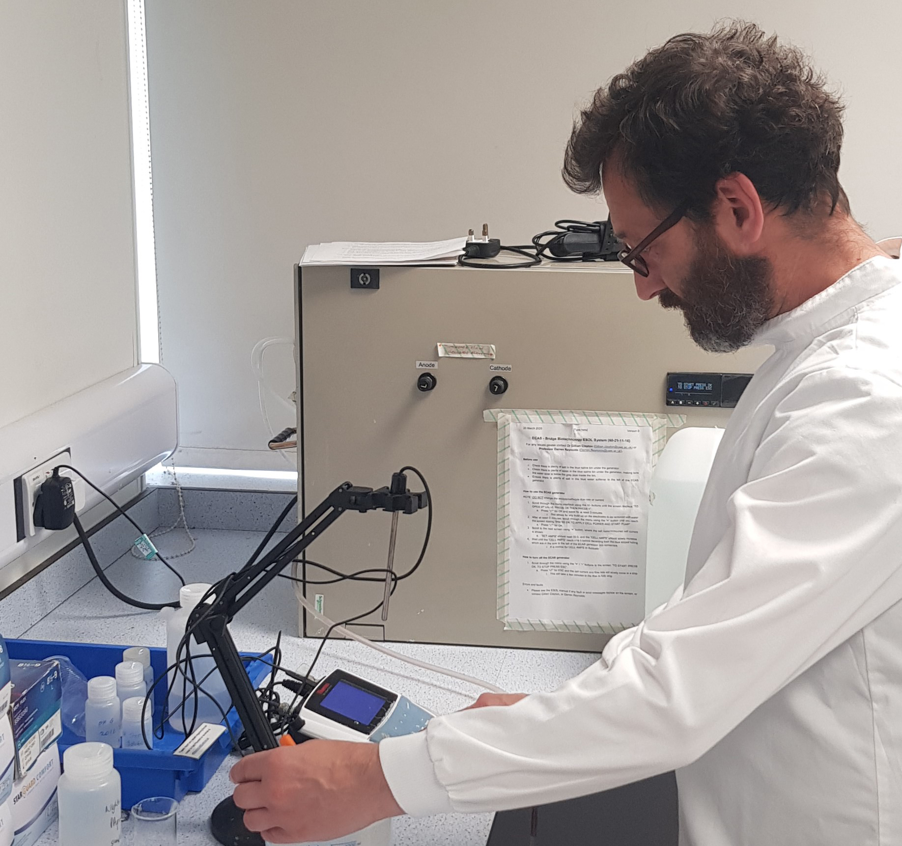 Man in lab coat working on Covid-19 research