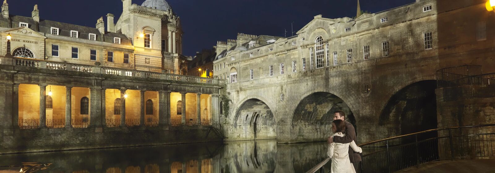 people in Bath city centre at night