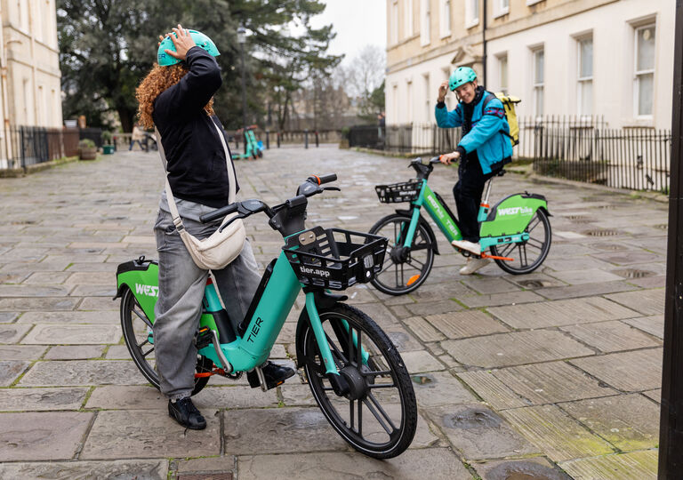2 people on tier e-bikes