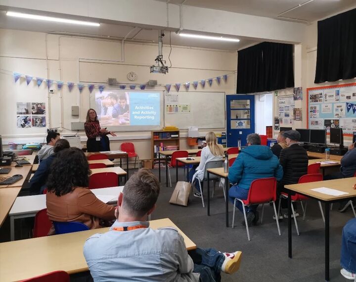 Classroom with teachers being given a presentation