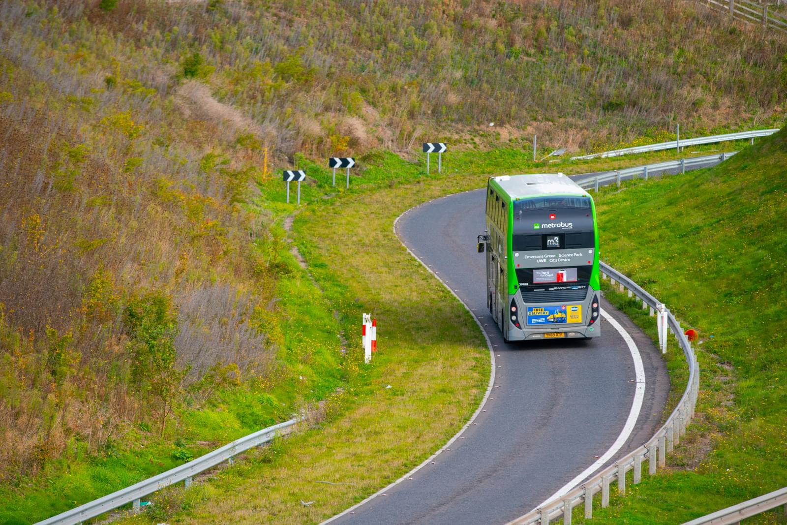 Bus driving through greenery