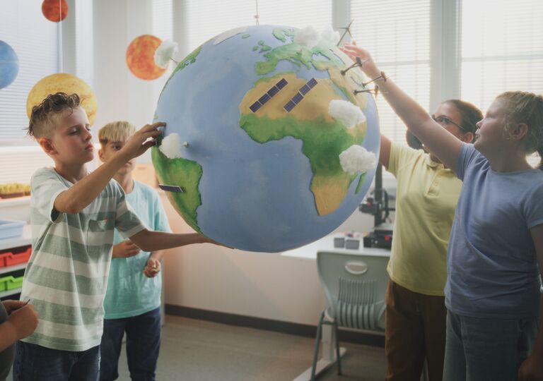 school children with globe