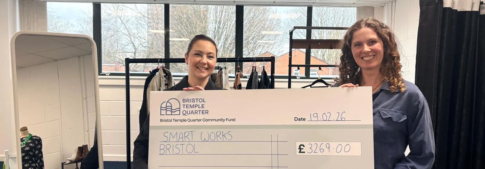 people holding a cheque