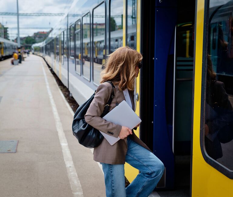 person getting on a train