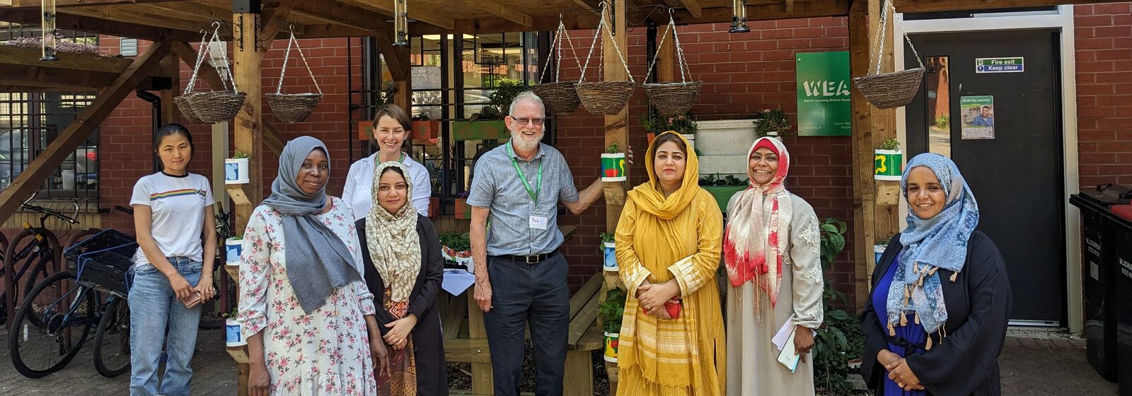 Group stood in front of community centre