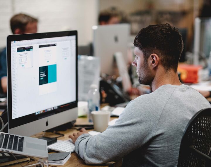 man staring at computer screen