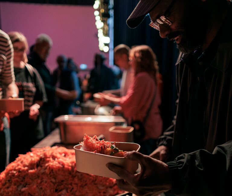 Hands grabbing food