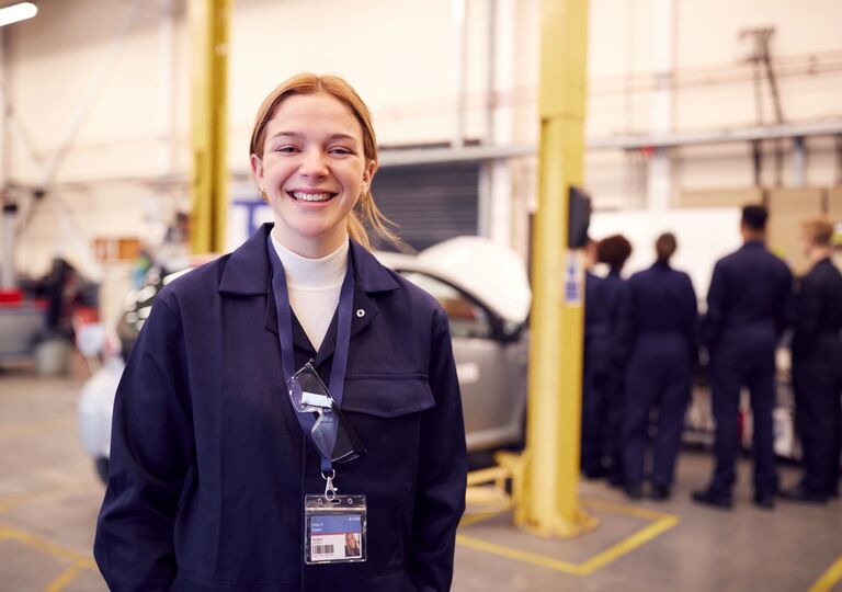 Young mechanic smiling