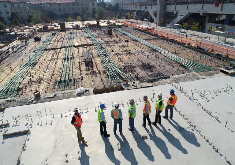 seven construction workers standing on building site