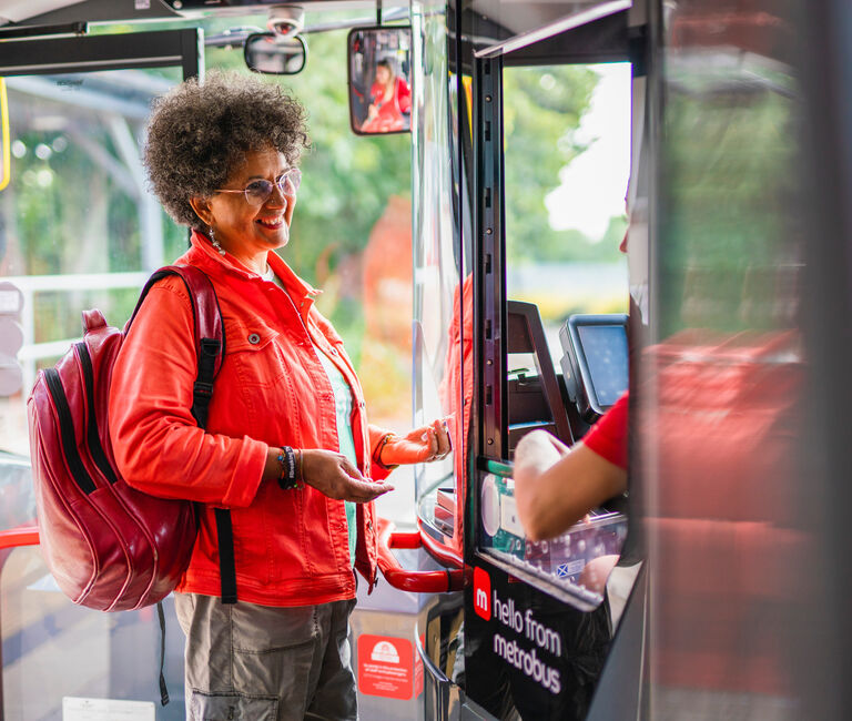 Person getting on bus