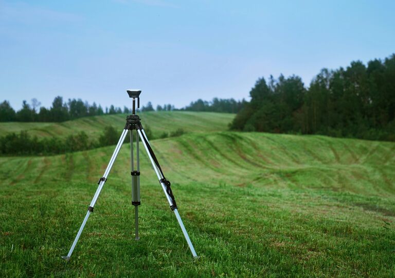 Tool on a tripod in a field