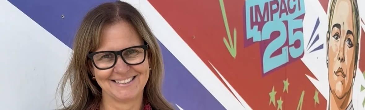 Helen next to Women's rugby world cup 2025 art