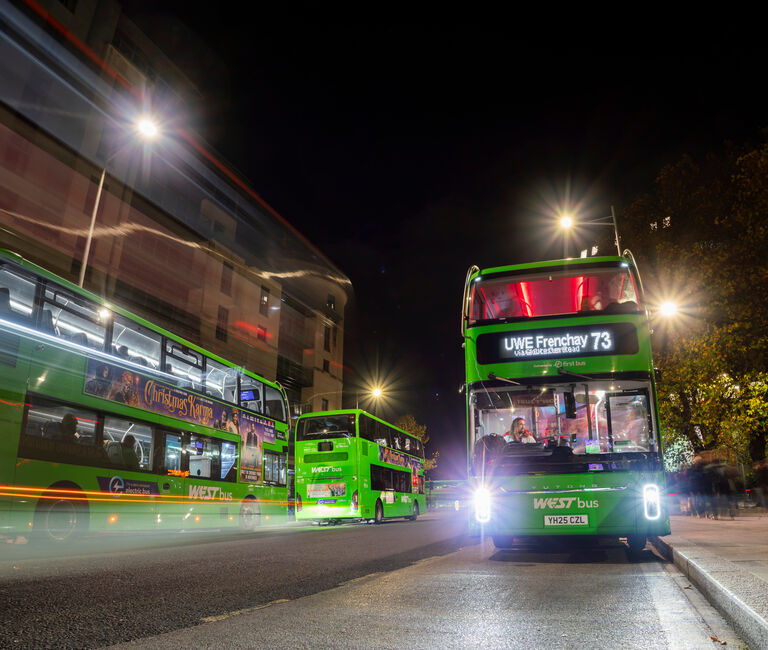 Buses on the road at night