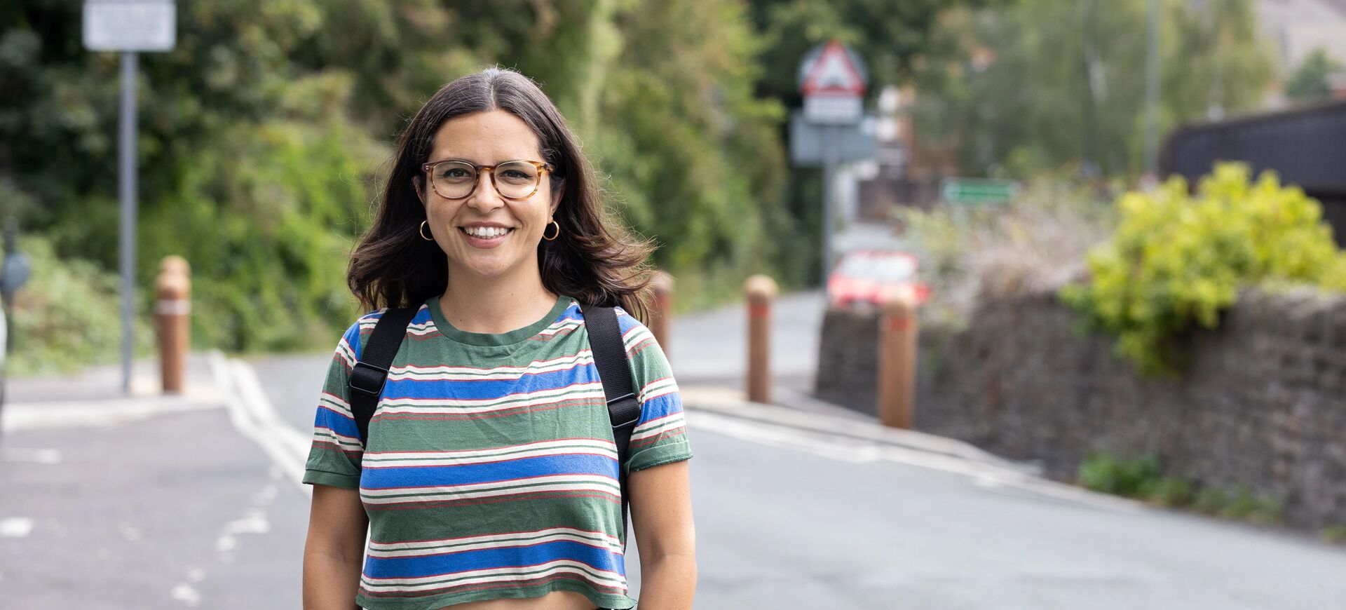 Young person smiling on a path