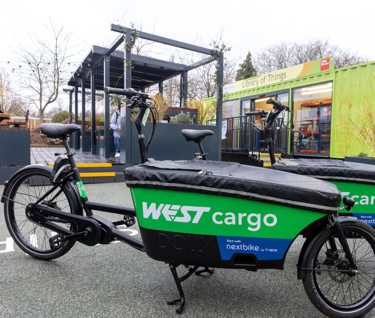 E-cargo bikes against a cargo container