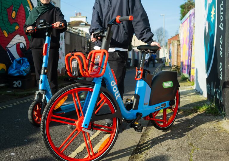 red and blue e-bike and e-scooter