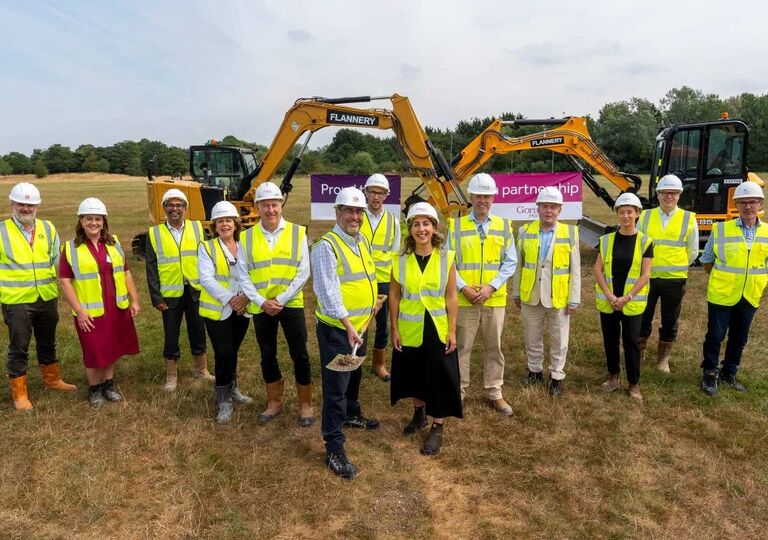 lots of people wearing high vis and hard hats breaking ground at hengrove park