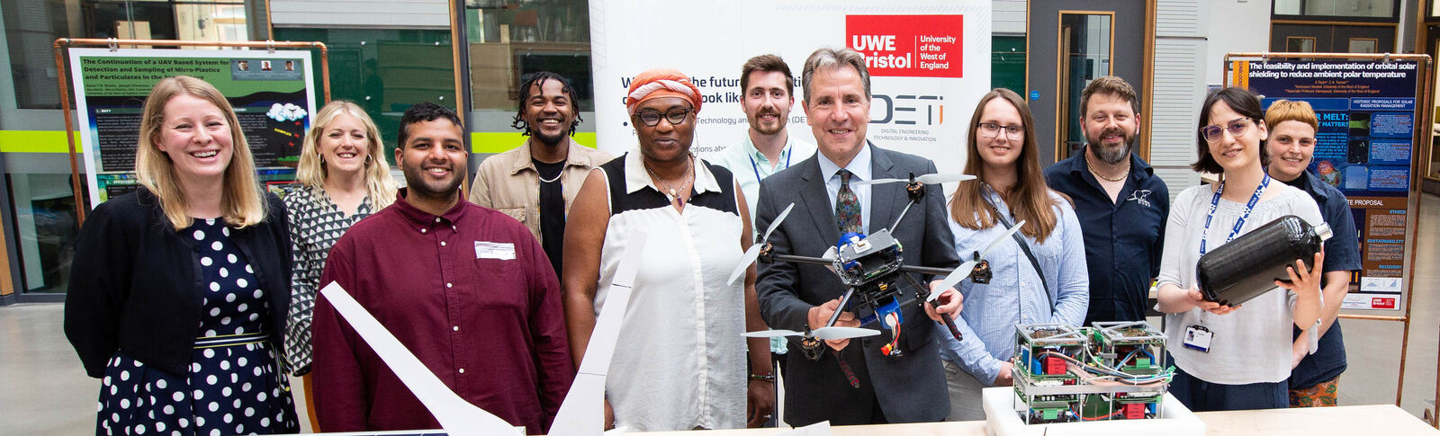 A group of people flank Metro Mayor Dan Norris, all smiling at the camera at a Skills Event. Dan holds a drone.