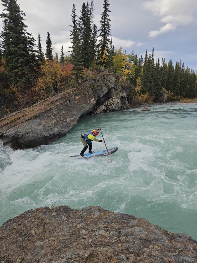 white water paddle boarder on the river