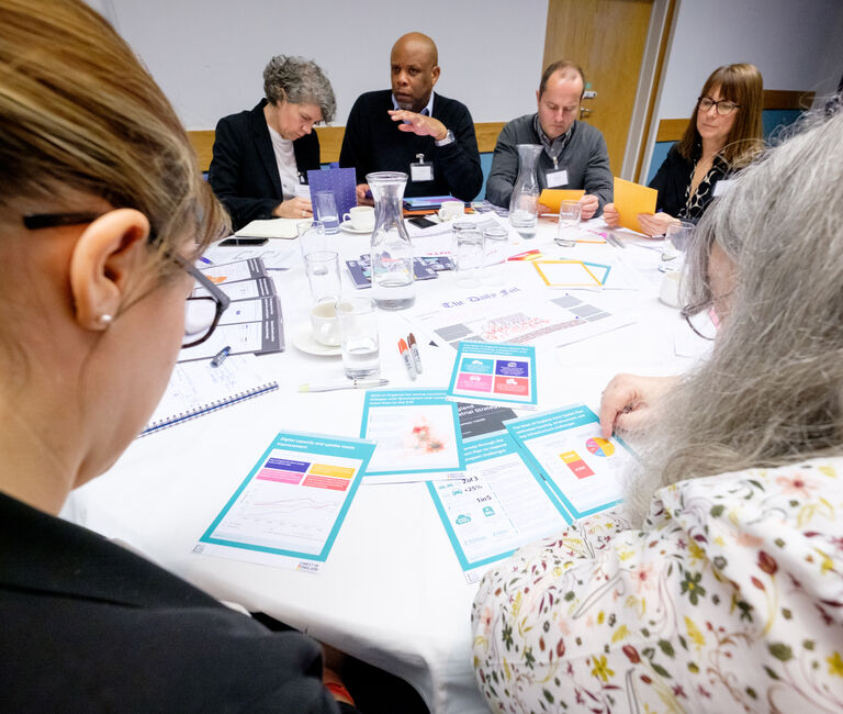 A group workshopping at a table