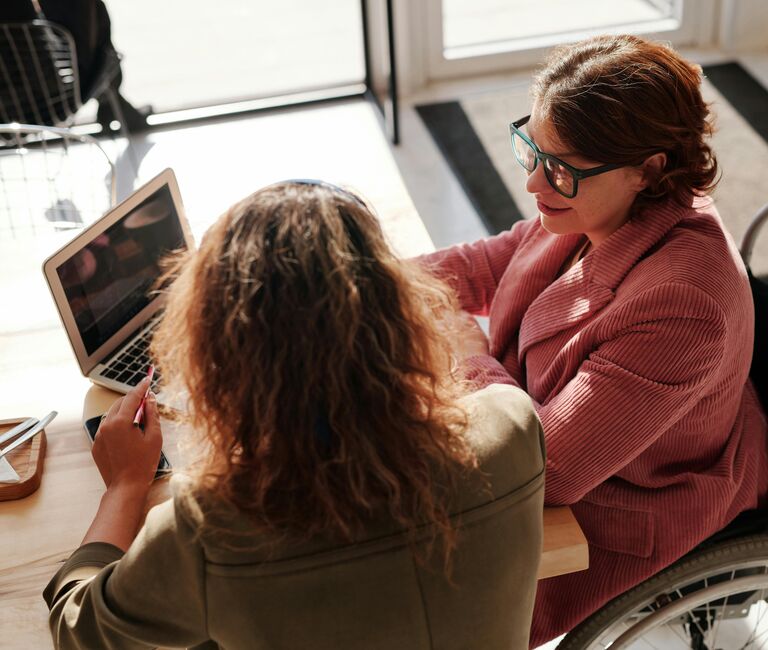 People working at a tablet