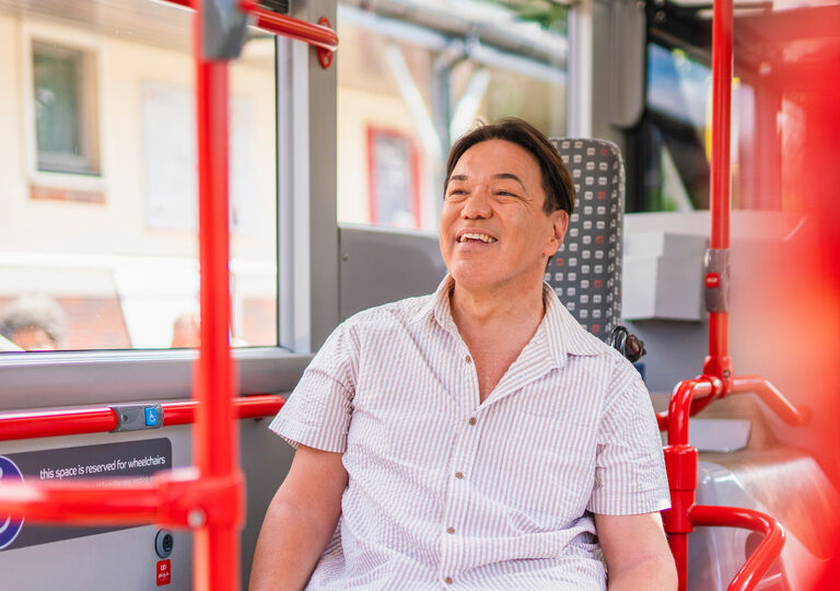 Disabled person in wheelchair on board a bus