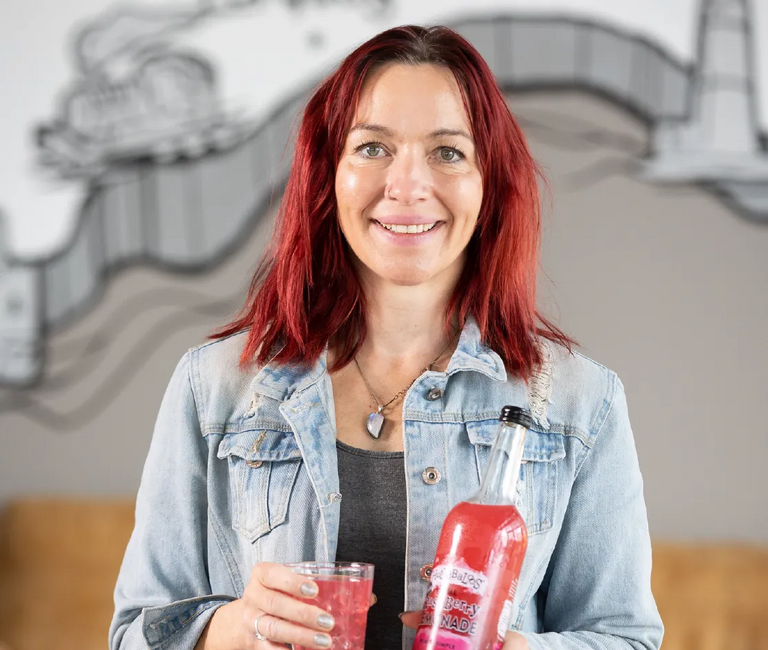 Person holding bottles