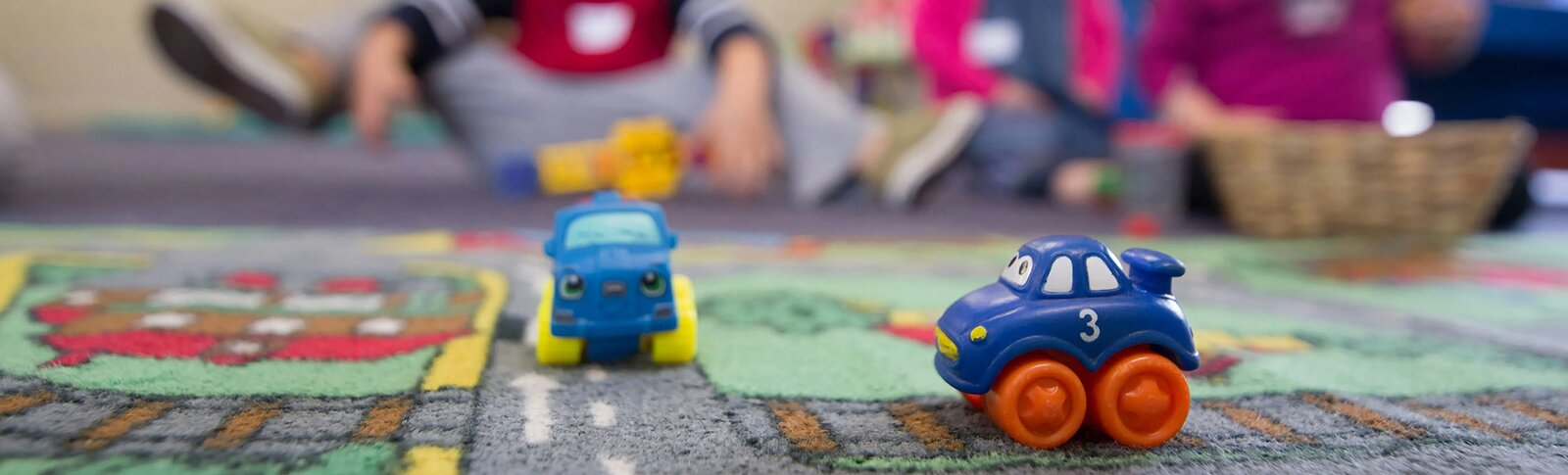 Toy cars on mat