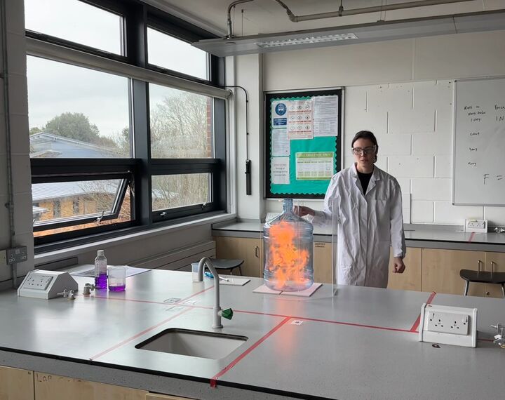 Woman teaching science experiment