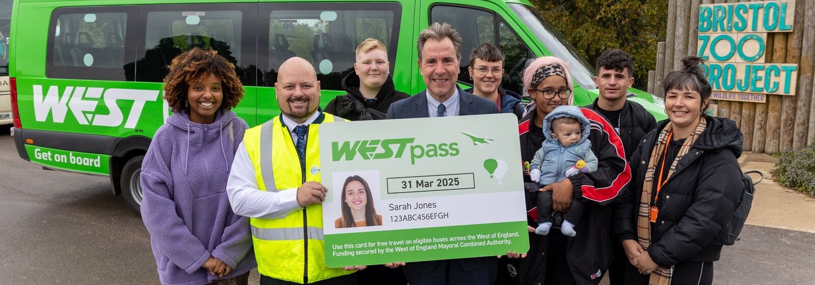 Dan Norris and group of care leavers stand in front of a westlink bus