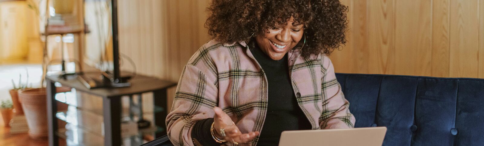 Person smiling on laptop