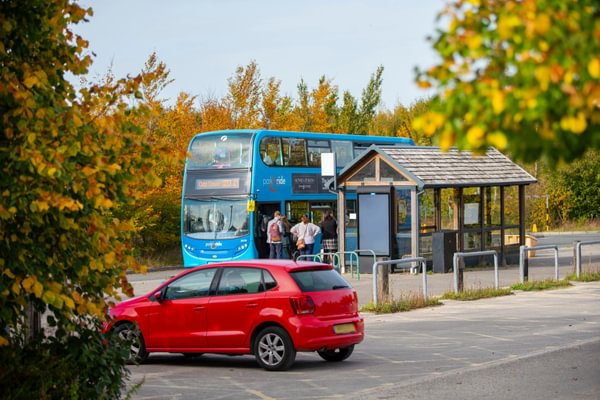 A road with cars and bus