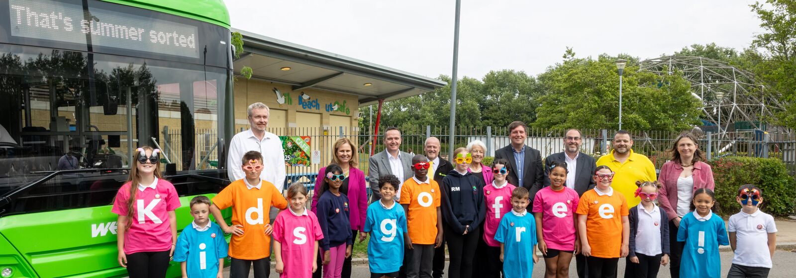 Helen Godwin, the new Mayor of the West of England, is pictured with council leaders, bus operators, a bus, and play park - with children wearing t-shirts spelling out 