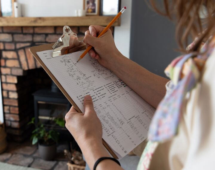 A lady noting down something
