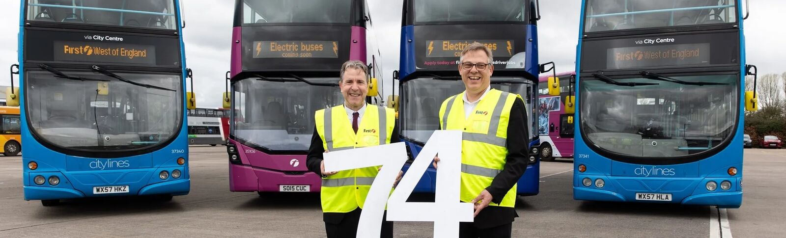 Mayor Norris with Doug Claringbold holding a ‘74’ sign at the Hengrove Depot