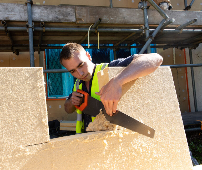 Someone cutting through insulation