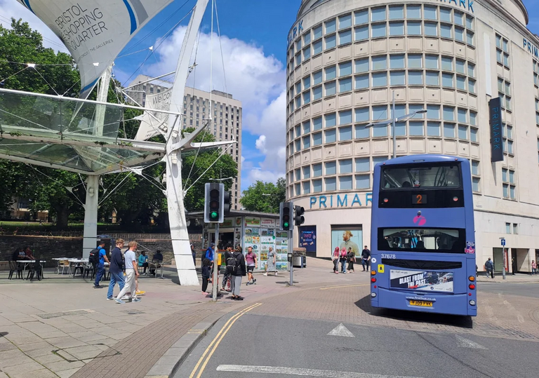 Back of the number 2 bus travelling past Primark in Bristol city centre