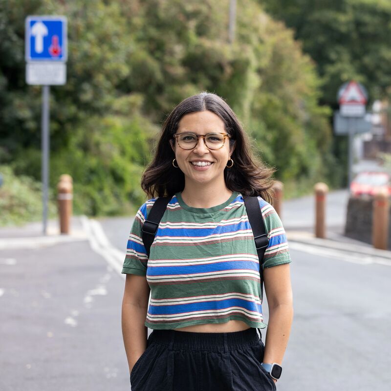 Young person smiling on a path