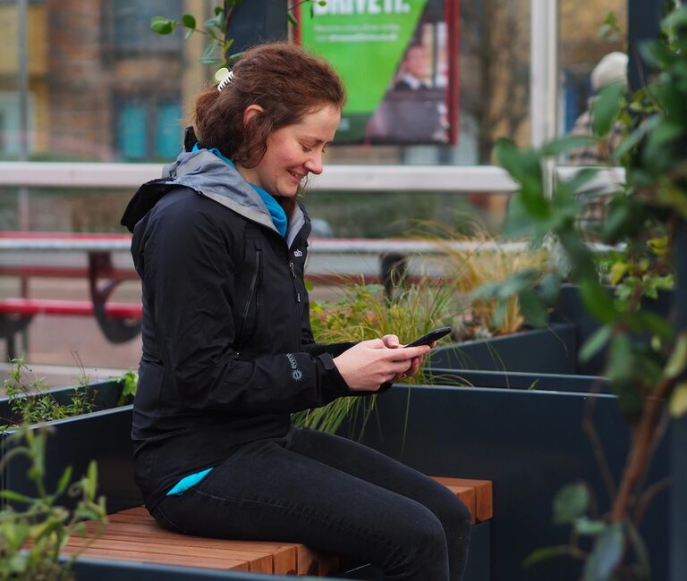 Person sat on their phone