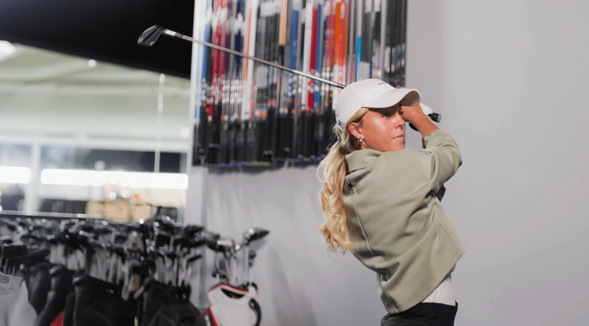 a golfer in a fitting bay at 2nd swing