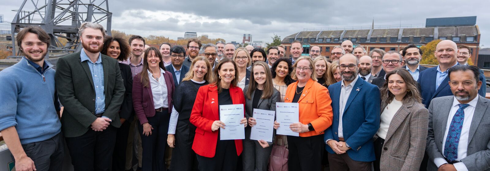 Helen Godwin, Mayor of the West of England; Jessi Olsen, COO and CFO of Elevate Quantum; and Evelyn Welch, Vice-Chancellor of the University of Bristol, are pictured with the MOU in a group photo.