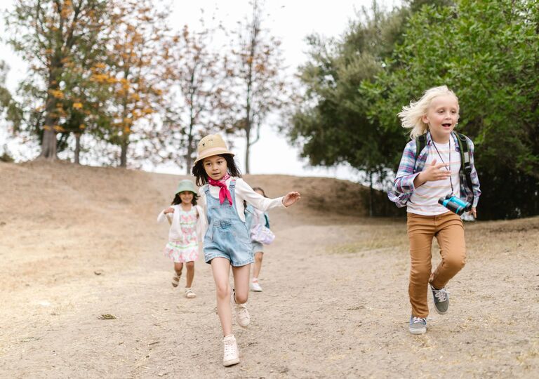 children running playfully outside