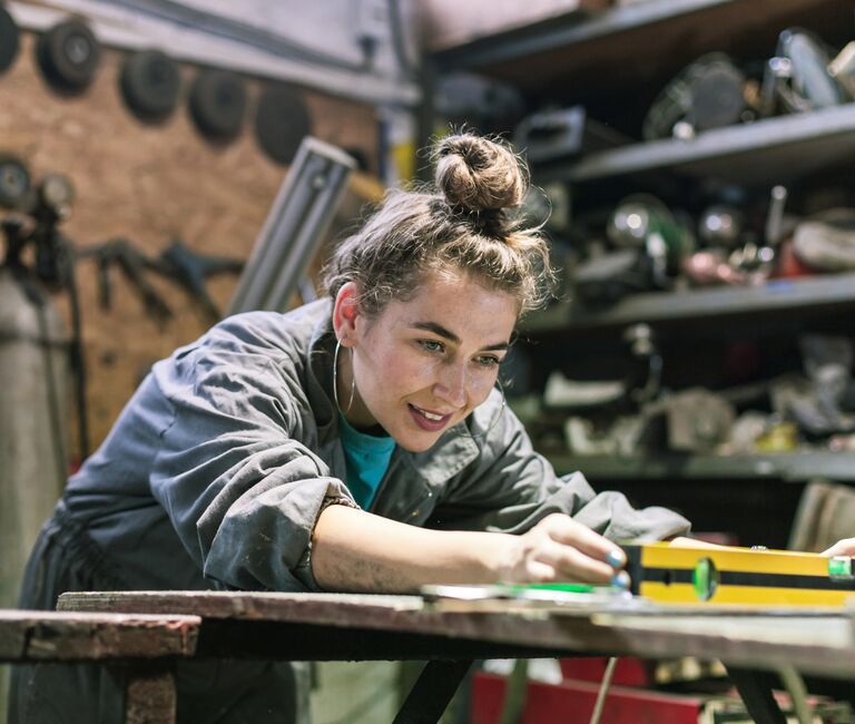 Person working on a woodbench