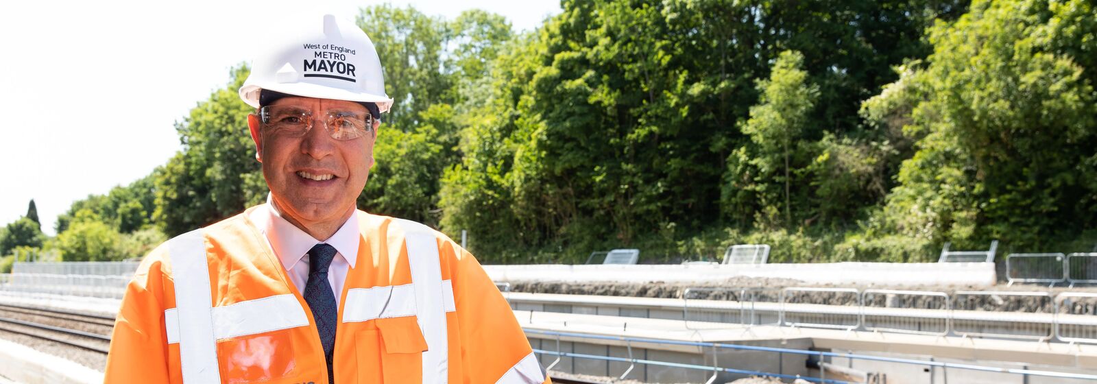 Mayor Dan Norris stood by a rail track