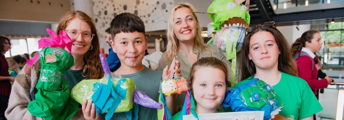 People are pictured with environmental models.